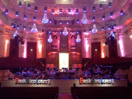 stage design for concert with chandeliers as decoration and lightning