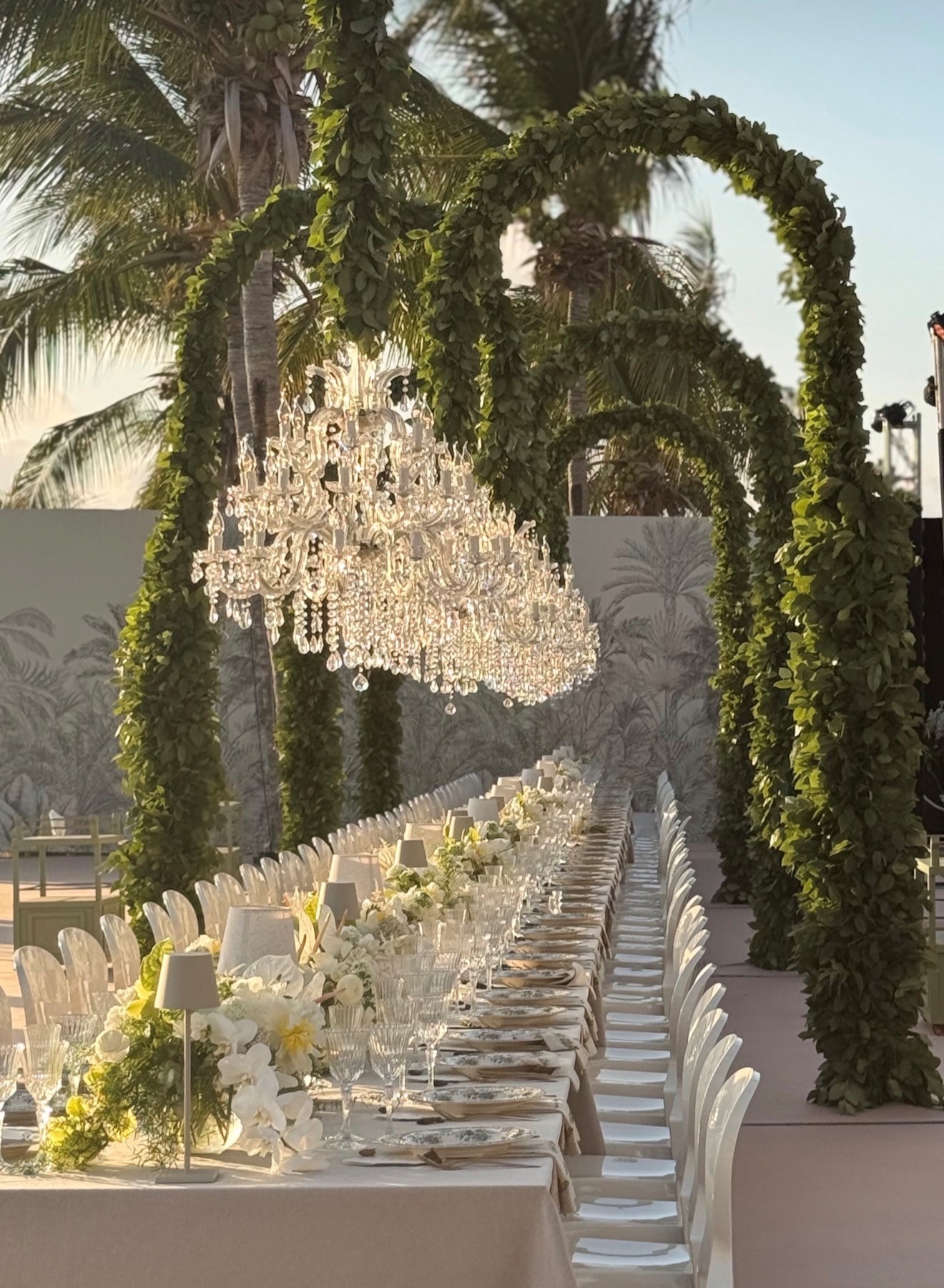 Wedding lighting rental in Aruba with a crystal chandelier above the dinner table